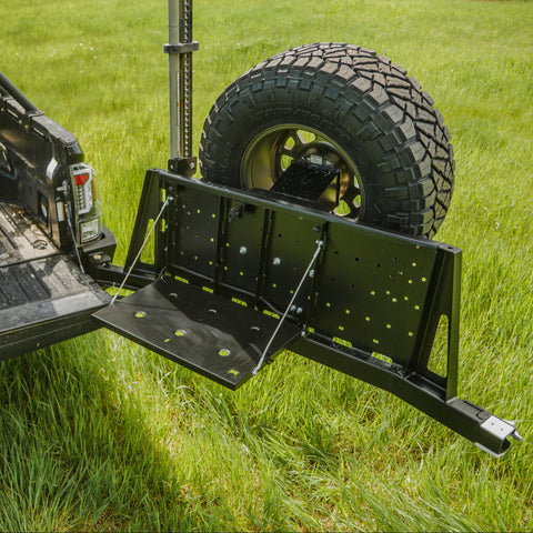 High-angle view showing the C4 swing-out deployed with the accessory table down and tailgate open.