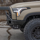 Close-up shot from the side of the C4 Overland bumper for the Toyota Tundra showing its tight conformation to the front of the grille.
