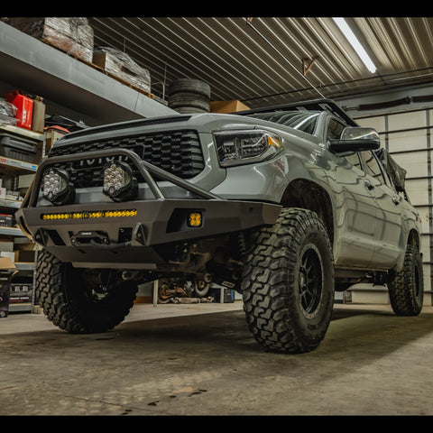 Low angle view of the C4 Overland bumper with full-height bull bar with tube gussets installed on a grey 2nd Gen Tundra.