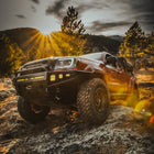 Sunrise wheeling with a red Tacoma equipped with a C4 Hybrid front bumper.